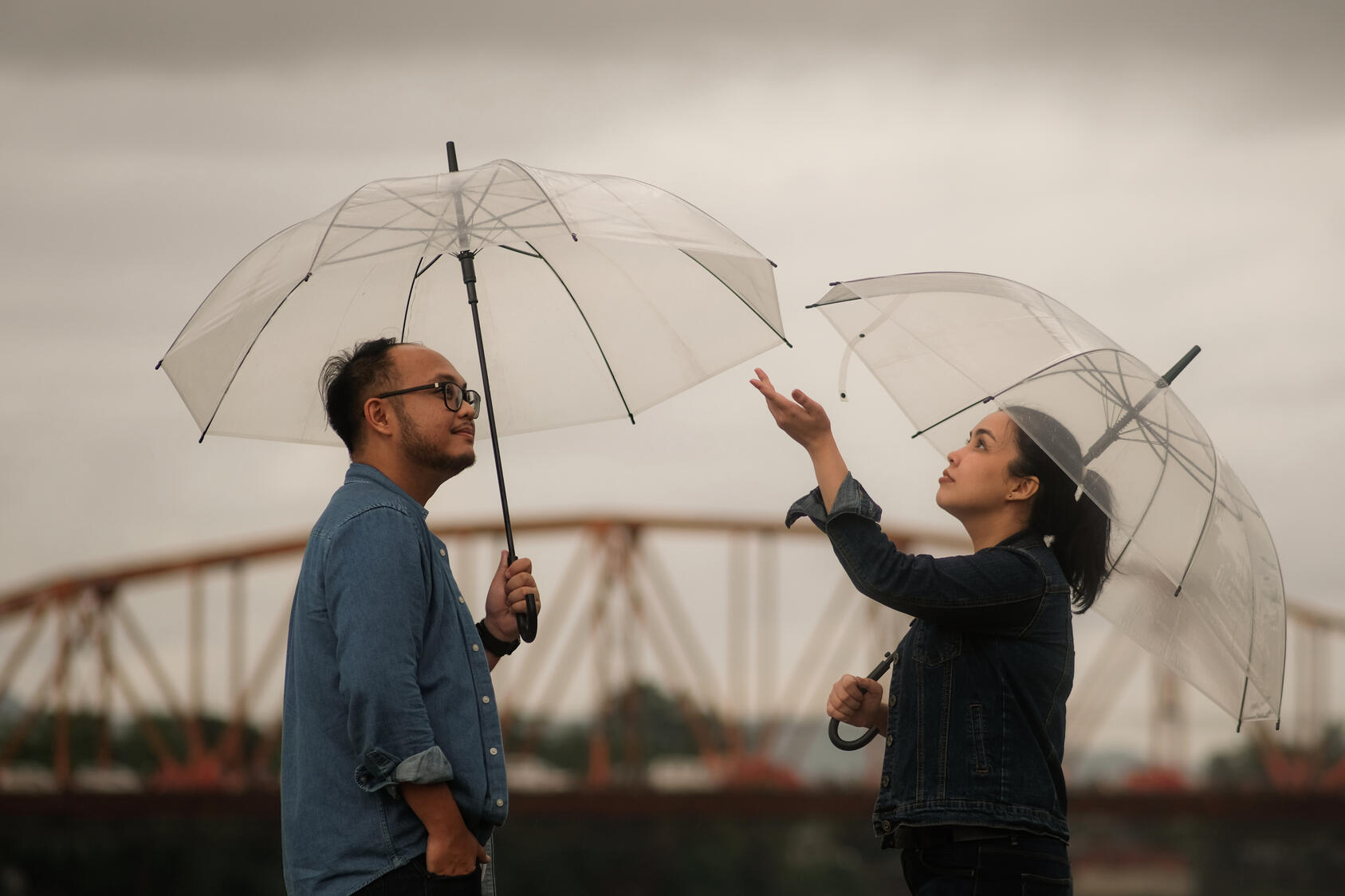 with my handsome husband, the love of my life a rainy day beside the bridge